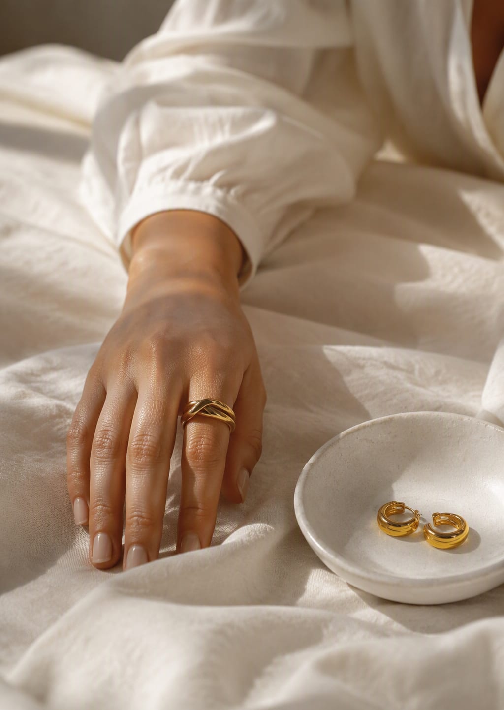 Gold band on white linen